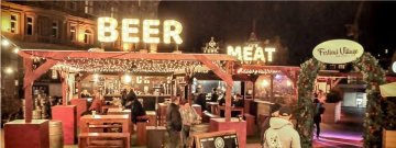 Malones in Edinburgh city scene with illuminated signage